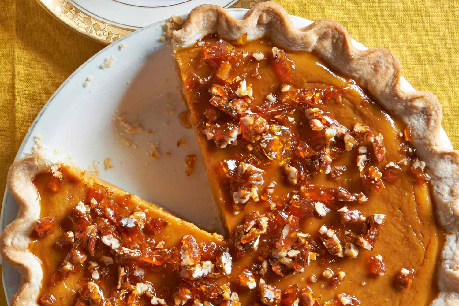 Pumpkin Cheesecake Topped with Sweet Maple Pecan Brittle