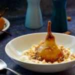 Spiced Hazelnut Crumble Elevates Poached Pears